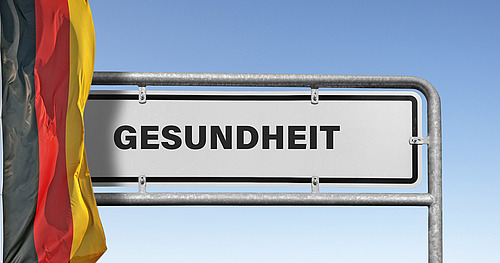 Symbolbild: Gesundheit, Schild mit Nationalfahne